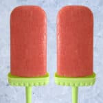 Homemade fruit popsicles on ice