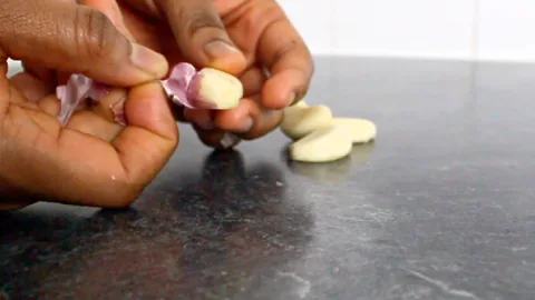 peeling garlic